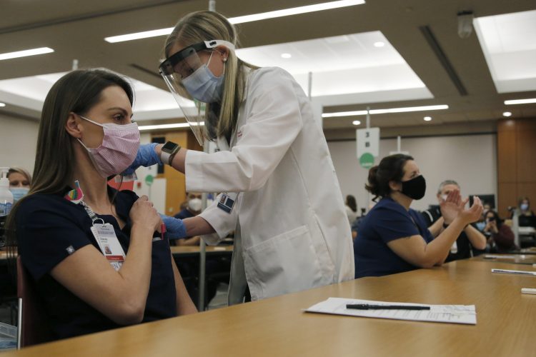‘Healing Is Coming’: U.S. Health Workers Start Getting Vaccine